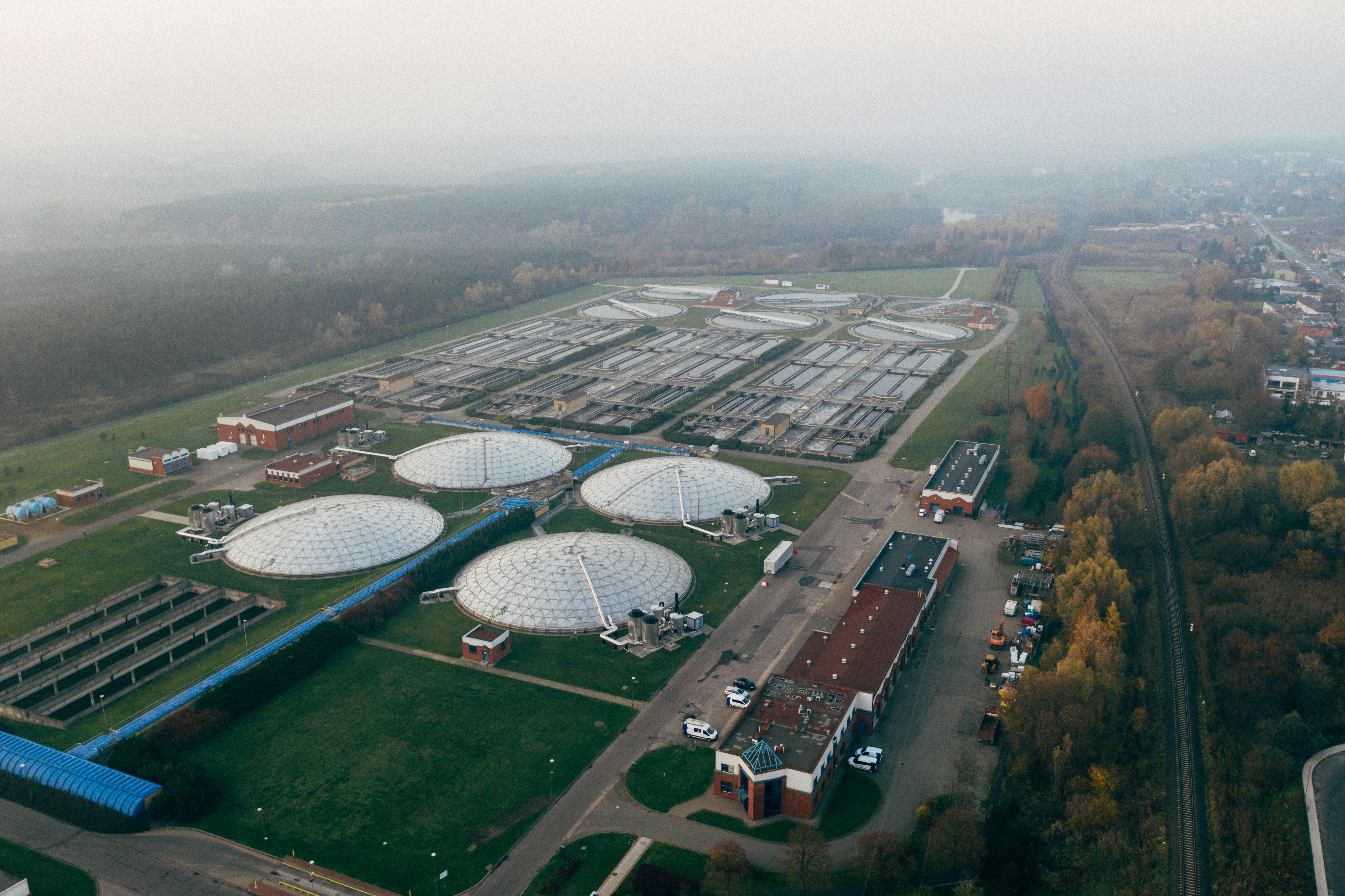 Aerial shot of a wastewater treatment facility in Poznań, showcasing industrial technology and environmental effort.